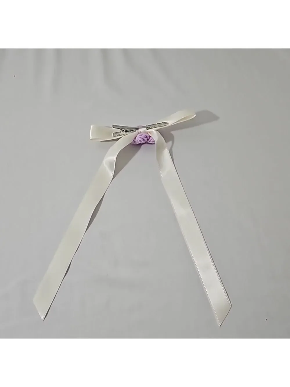 Hand Crafted Ivory Bow with Purple Crochet Flower